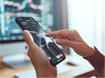 Person analyzing financial data on a smartphone app, representing success with advanced fintech web development solutions