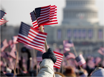 people holding up national flag, symbolizing successful government engagement through web development and digital marketing