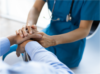 Healthcare professional comforting a patient, representing success with web development and digital marketing in healthcare