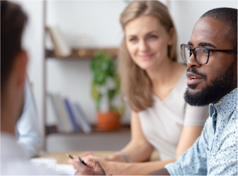 people in a meeting, indicative of professional services enhanced by web development and digital marketing services