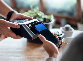 Mobile payment being processed in person, showcasing seamless retail and consumer goods experiences through web development